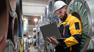 Manufacturing worker on laptop